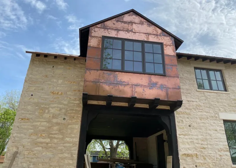 Copper metal panel facade on a stone building for Metal Roof Coating in North Laurel